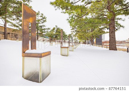 Overcast view of a snowy garden of Oklahoma City National Memorial and Museum 87764151