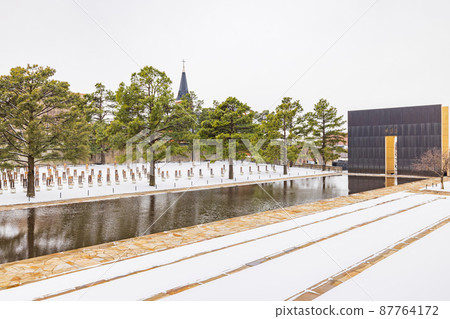 Overcast view of a snowy garden of Oklahoma City National Memorial and Museum Overcast view of a snowy garden of Oklahoma City National Memorial and Museum 87764172