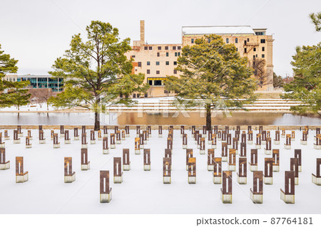 Overcast view of a snowy garden of Oklahoma City National Memorial and Museum Overcast view of a snowy garden of Oklahoma City National Memorial and Museum 87764181