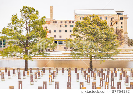 Overcast view of a snowy garden of Oklahoma City National Memorial and Museum Overcast view of a snowy garden of Oklahoma City National Memorial and Museum 87764182