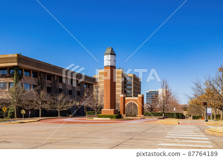 Sunny exterior view of the clock tower of University of Oklahoma Sunny exterior view of the clock tower of University of Oklahoma 87764189