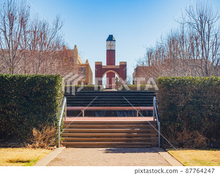 Sunny exterior view of the clock tower of University of Oklahoma 87764247