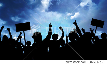 Silhouettes of people demonstrating _ dark sky background wide 87766730