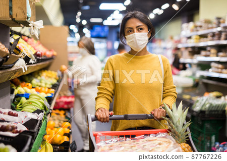 Woman in protective mask shopping at store 87767226