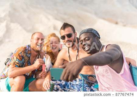 four friends having fun and posing for a selfie 87767474