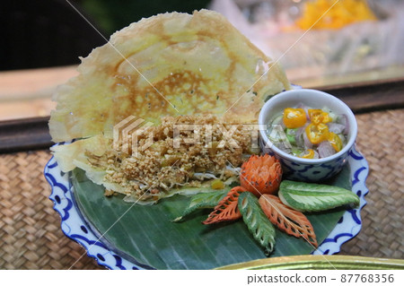 Vietnamese Savory Crepe set on Thai dish. 87768356