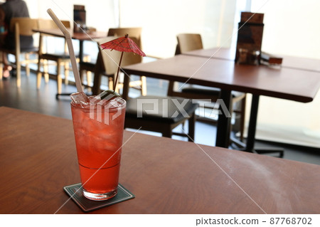A glass of punch on table. A glass of punch on table. 87768702