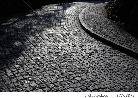 Fashionable cobblestone road 87768875