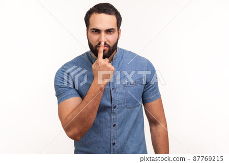 You are liar. Angry dissatisfied man with beard pointing finger at nose, showing lie gesture, blaming and suspicion you, body language. Indoor studio shot isolated on white background You are liar. Angry dissatisfied man with beard pointing finger at nose, showing lie gesture, blaming and suspicion you, body language. Indoor studio shot isolated on white background 87769215