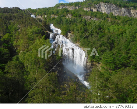 Waterfall near Stave Church in Borgund, Norway 87769332