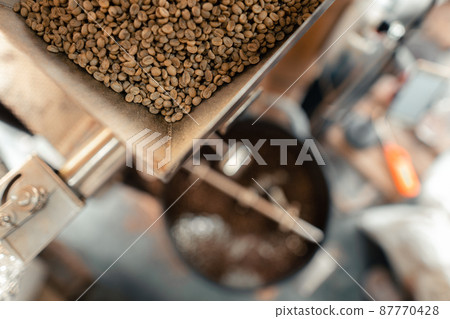 Roasted coffee beans in a cooling machine Roasted coffee beans in a cooling machine 87770428