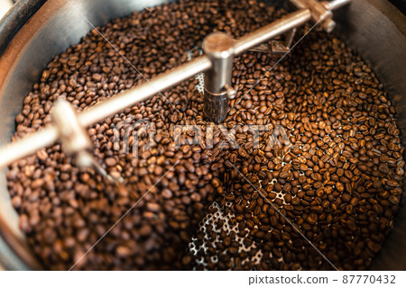 Roasted coffee beans in a cooling machine Roasted coffee beans in a cooling machine 87770432