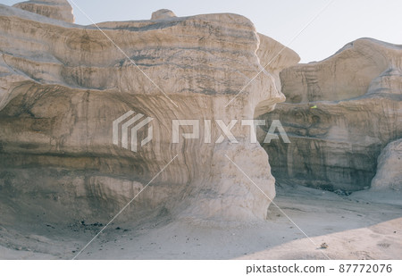Dry sandstone formations in canyon in desert 87772076