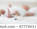 Syringe with blur baby background. Vaccine antivirus for infant .concept 87774031