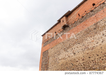 brick wall of an old castle with toilet room brick wall of an old castle with toilet room 87774367