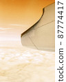 A wonderful view from the window of an airplane Orange sky 87774417