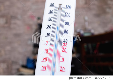 Room mercury thermometer on the table closeup 87775702