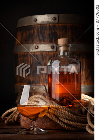 Glass and bottle with cognac Glass and bottle with cognac 87776002