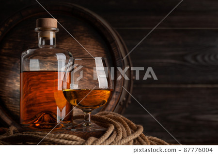 Glass and bottle with cognac 87776004