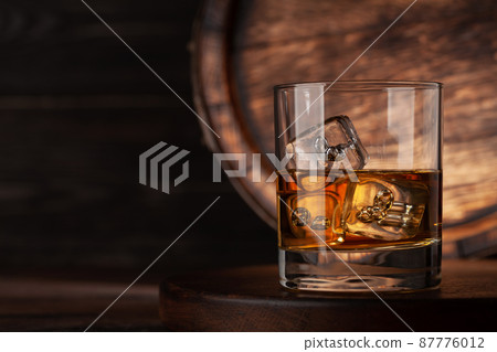 Glass with whiskey 87776012