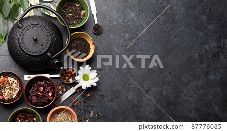 Various dried tea and teapot 87776085