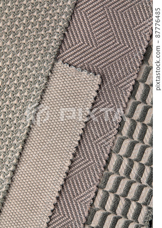 The background consists of several types of colored tiles with different patterns on beige tone The background consists of several types of colored tiles with different patterns on beige tone 87776485