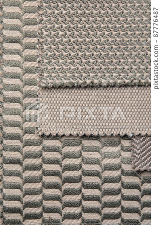 The background consists of several types of colored tiles with different patterns on beige tone The background consists of several types of colored tiles with different patterns on beige tone 87776487