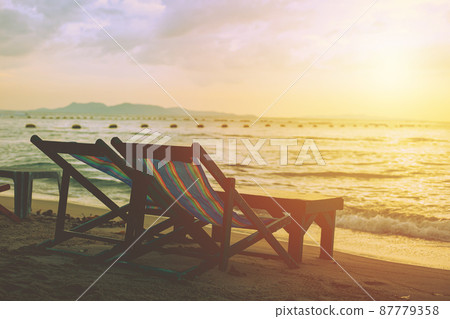 Beach chair sunset sea sky beautiful relax view in summer season quiet and calm Beach chair sunset sea sky beautiful relax view in summer season quiet and calm 87779358