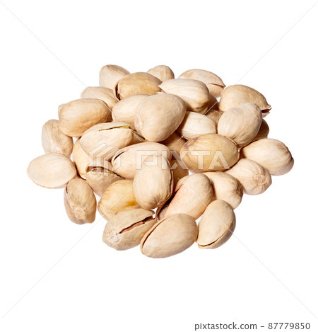 Pistachios heap isolated on white background. 87779850