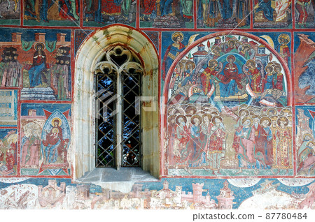 Humor Monastery, Suceava County, Moldavia, Romania: One of the famous painted churches of Moldavia. Detail of the colorful medieval frescoes on the Dormition of the Mother of God Church. 87780484