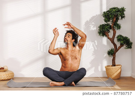 Calm African American man meditating in morning 87780757