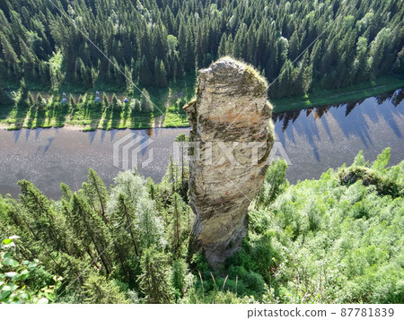 Picturesque rock Chertov Finger and Usva river. View from above. Massif Usvinskiye Pillars. Perm region. Russia Picturesque rock Chertov Finger and Usva river. View from above. Massif Usvinskiye Pillars. Perm region. Russia 87781839