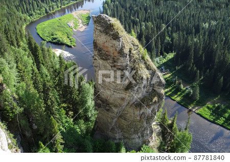 Picturesque rock Chertov Finger and Usva river. View from above. Massif Usvinskiye Pillars. Perm region. Russia Picturesque rock Chertov Finger and Usva river. View from above. Massif Usvinskiye Pillars. Perm region. Russia 87781840