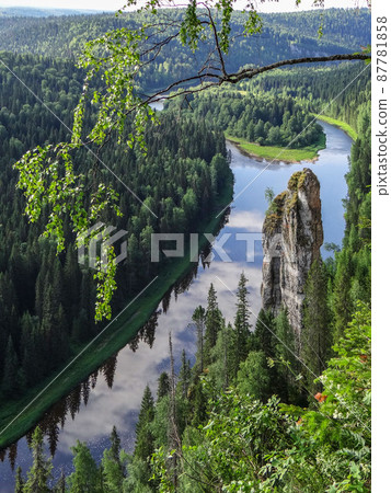 Picturesque rock Chertov Finger and Usva river. View from above. Massif Usvinskiye Pillars. Perm region. Russia Picturesque rock Chertov Finger and Usva river. View from above. Massif Usvinskiye Pillars. Perm region. Russia 87781858