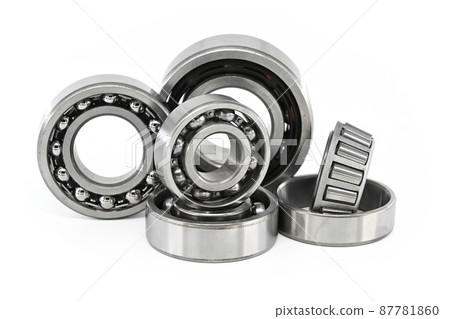 Group of various ball and roller bearings on white Group of various ball and roller bearings on white 87781860