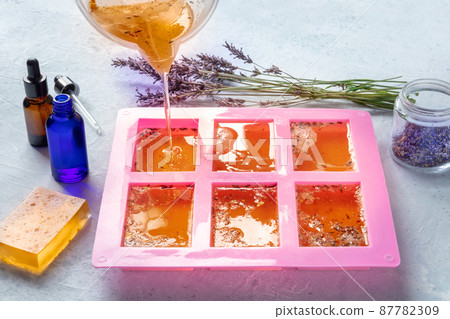 Handmade soap, the process of making. Liquid glycerin with lavender buds 87782309