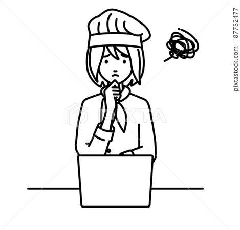 A cook woman sitting at a desk and opening her PC A cook woman sitting at a desk and opening her PC 87782477
