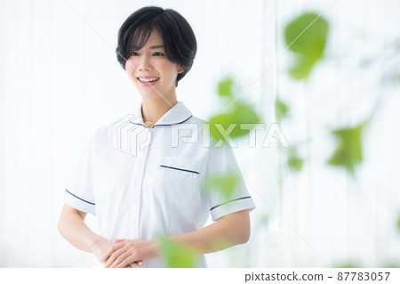 A lady in white A lady in white 87783057