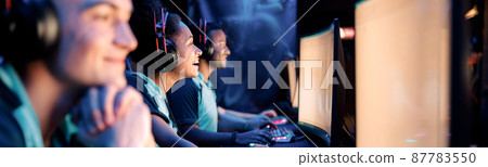 Professional team playing esports game on computers in internet club 87783550