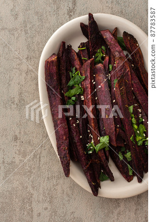 Oven baked purple sweet potato Oven baked purple sweet potato 87783587