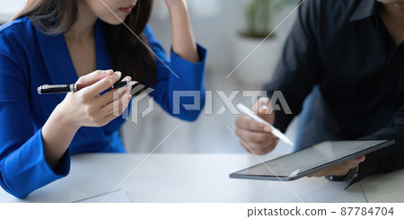 Group of IT consultant working by digital tablet and management big data and analyze financial document of company. Group of IT consultant working by digital tablet and management big data and analyze financial document of company. 87784704