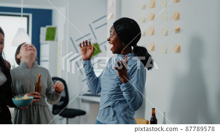 African american woman winning football game African american woman winning football game 87789578