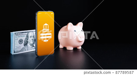 Online payment. Smartphone with internet online bank application. Usd money cash on black background. Save currency money wallet. Online payment. Smartphone with internet online bank application. Usd money cash on black background. Save currency money wallet. 87789587