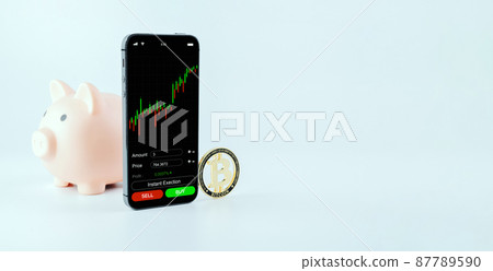 Crypto currency exchange. Pink pig bank, gold crypto currency BTC bitcoin on white background. Bitcoin trading mobile phone app. Save money investment and business finance. Crypto currency exchange. Pink pig bank, gold crypto currency BTC bitcoin on white background. Bitcoin trading mobile phone app. Save money investment and business finance. 87789590