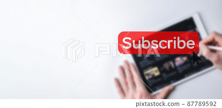 Subscribe button. Online video subscription red button. Internet service on laptop digital tablet blured banner background. Visual contents concept. Social networking service. Subscribe button. Online video subscription red button. Internet service on laptop digital tablet blured banner background. Visual contents concept. Social networking service. 87789592