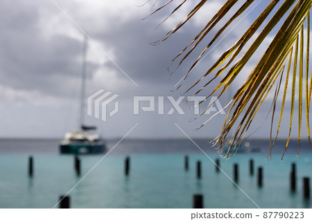 Sailboat on azure sea in stormy weather. Selective focus. 87790223