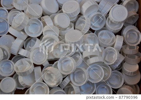 Background made with many white plastic bottle caps 87790396