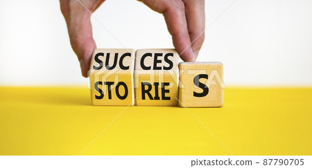 Success stories symbol. Businessman turns wooden cubes and changes the word stories to success. Beautiful yellow table, white background, copy space. Business success stories story concept. Success stories symbol. Businessman turns wooden cubes and changes the word stories to success. Beautiful yellow table, white background, copy space. Business success stories story concept. 87790705