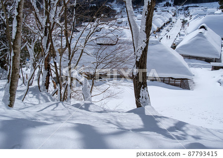 Snowy mountains and thatched roof Snowy mountains and thatched roof 87793415