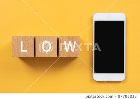 Building blocks and smartphones with "LOW" written on them 87793838
